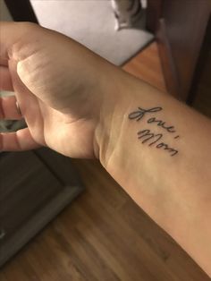 a person with a tattoo on their arm that says, you are my mom in cursive writing