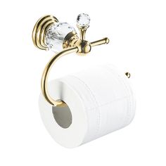 a gold toilet roll holder with clear glass knobs