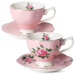 three cups and saucers with pink roses on them