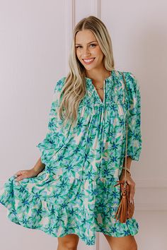 - Make memories one mimosa at a time in this darling dress! - Lightweight material with a floral print and a built-in skirt lining - A v-cut neckline with a tie - A smocked detail - Long, loose sleeves with elastic cuffs - A flowy silhouette that ends in A mini dress length hemline Chic Green V-neck Floral Dress, Green Printed Summer Dress, Green Printed Floral Dress For Vacation, Green Knee-length Floral Dress For Vacation, Flowy Green Mini Dress For Brunch, Green Knee-length Brunch Dress, Casual Green V-neck Floral Dress, Casual Green Floral Dress With V-neck, Green Floral Summer Beach Dress