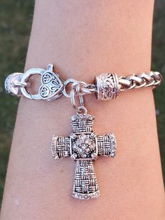 Pretty crystal cross bracelet  the cross is made of Antique silver plated, lead~free, nickel~free, cadmium~free   Stainless steel braided bracelet fitting up to an 8" wrist  Quantity: 1 Bracelet as shown     Thank you for visiting my shop! Nickel Free Silver Cross Bracelets, Silver Cross Bracelet, Spiritual Style, Nickel-free Silver Cross Bracelets, Spiritual Silver Charm Bracelet With Cross, Spiritual Silver Cross Charm Bracelet, Silver Nickel-free Cross Bracelet, Spiritual Silver Cross Bracelet, Nickel-free Silver Cross Rosary Bracelet, Silver Cross Rosary Bracelet