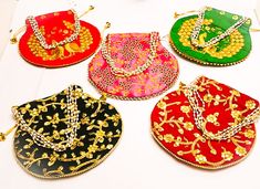 Potli Bag Dimension :- H*L (cm) : 23*24 ) , (H*L: 9* 9.5( Inch) (Handle Dimension :- H* L (cm) 20*14) (Type:-Pearl Drawstring) * Accessibility : Used to carry earrings, rings, bracelets and other jewelry items. Coins, cards with easy accessibility which keeps your items anti-dust. Other usage as storage for necklaces, bangles and other accessories to prevent it from tangling * This Potli Bag is Made From dupion silk , velvet, Product Primary Work at Brocade Patchwork, * Closure : Being lightweig Multicolor Potli Bag For Wedding And Navratri, Green Potli Bag For Wedding, Bollywood Style Multicolor Wedding Bags, Multicolor Bags For Diwali Celebration, Green Bag With Zari Work For Wedding, Bollywood Style Multicolor Potli Bag For Wedding, Bollywood Style Multicolor Festive Bags, Green Festive Potli Bag For Wedding, Green Zari Work Potli Bag For Wedding