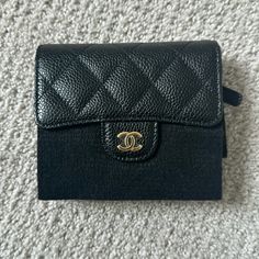 Brand New Chanel Tri Fold Wallet Plastic And Encasing Still Intact Includes Box, Case, Receipt, Authentication Cards / Full Set No Flaws/No Wear/Never Used Dimensions: 4.5"W X 4"H X 1"D Comes From A Smoke/Pet Free Environment. No Trades. Please Ask All Questions Before Purchasing. Thanks. Black Compact Luxury Bag, Luxury Black Compact Bag, Luxury Compact Black Bag, Designer Coin Purse With Card Slots For Daily Use, Designer Compact Coin Purse For Travel, Luxury Compact Wallet With Coin Pocket, Luxury Evening Coin Purse With Interior Card Slots, Luxury Evening Coin Purse With Card Slots, Designer Black Compact Coin Purse