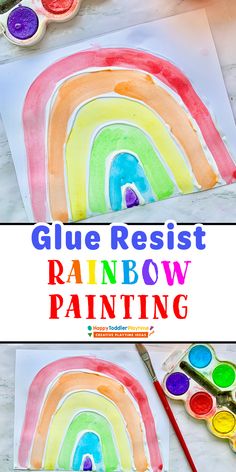 the rainbow painting is being made with glue and watercolors