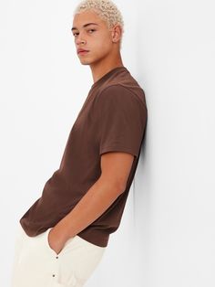 Made with 100% organically grown cotton.  Organic cotton is better for people and the environment because it's grown without the use of harmful synthetic pesticides and fertilizers.  Crewneck.  Short sleeves.  Classic fit.  Easy through the chest, shoulders, and waist.  Hits at the hip. Gap Short Sleeve Tops For Everyday, Casual Brown Tops By Gap, Gap Graphic Tee With Short Sleeves, Gap Casual T-shirt With Relaxed Fit, Basic Crew Neck T-shirt By Gap, Basic Gap Crew Neck T-shirt, Casual Gap T-shirt, Gap Summer T-shirt For Everyday Wear, Gap Crew Neck T-shirt For Everyday