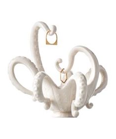 a white swan sculpture sitting on top of a table