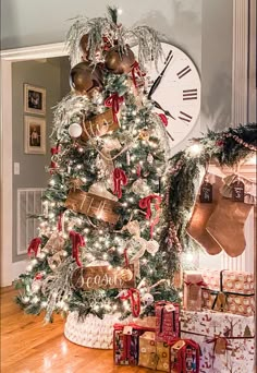 a decorated christmas tree with stockings and stockings on it