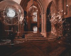 an old photo of the inside of a building with large glass balls in front of it