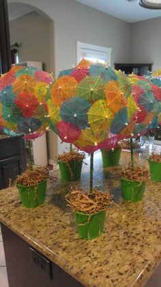 there are many colorful umbrellas on the counter