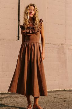 Effortlessly ethereal, this sweet midi from our free-est collection is the perfect romantic look. **Fit:** A-line silhouette with slim fit bodice **Features:** Exaggerated ruffled square neckline, billowy skirt design, tie-back closure **Why We | Ruffle It Up Midi Dress by free-est at Free People in Brown, Size: L Summer Midi Dress With Ruched Bodice, Tea Length, A-line Midi Dress With Ruffles For Garden Party, Feminine Ruffled Tea-length Midi Dress, Solid Midi Dress With Ruffles, Tea Length Ruffled Midi Dress For Garden Party, Garden Party Tea Length Midi Dress With Ruffles, Garden Party Tea-length Ruffled Midi Dress, Flowy Midi Dress With Ruffled Straps For Garden Party, Flowy Midi Dress With Ruffled Straps