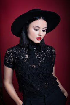 Step into the glamour of the past with this versatile, wide-brimmed hat. This timeless piece is handcrafted with care from 100% wool and is offered in both carbon black and fire-engine red. The American Gothic hat features a stunning, black ribbon that adds a touch of romance to this already beautifully, classic piece. Want to dress it up? Pair it with one of our versatile hat bands! Size details: Circumference - 57 cm. One size fits most. Brim: 10.5 cm. Fall Party Fitted Felt Hat, Classic Black Boater Hat For Party, Elegant Black Top Hat For Fall, Chic Fitted Hats For Fashion Events, Chic Black Boater Hat For Formal Occasions, Evening Fall Hat With Curved Brim, Evening Hats With Curved Brim For Fall, Evening Hats With Flat Brim For Fall, Flat Brim Hats For Evening And Fall