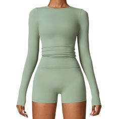 This Brushed long-sleeved yoga suit is designed to provide maximum comfort and flexibility during your yoga practice. Made from a soft, brushed fabric, it keeps you warm and cozy while allowing you to move freely. Perfect for any level of yoga enthusiast. Solid Color Activewear With Thumbholes For Pilates, Solid Activewear With Thumbholes For Pilates, Pilates Activewear With Thumbholes, Versatile Green Long Sleeve Activewear, Green Long Sleeve Sportswear Activewear, High Stretch Long Sleeve Activewear With Thumbholes, Green Long Sleeve Yoga Activewear, Green Long Sleeve Activewear For Workout, Fitted Long Sleeve Yoga Activewear