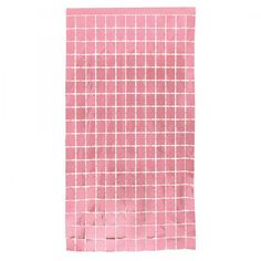 a piece of pink paper with white squares on it