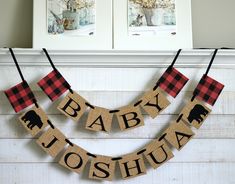 a baby shower banner hanging on the mantle