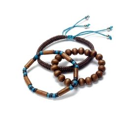 New Rogue Accessories Wooden Brown Bracelet Set. Elastic For Easy Slide On. Set Includes Braided Brown Leather Bracelet. A Set Of Brown Beads With A Set Of Brown And Turquoise Oblong Beads. New Retail For $20.00 Rogue Accessories, 3 Strand Bracelet, Brown And Turquoise, Brown Leather Bracelet, Brown Bracelet, Strand Bracelet, Slide On, On Set, Womens Jewelry Bracelets