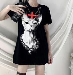 This unique gothic harajuku cat cross print chain design t-shirt is perfect for any goth-inspired look. crafted from soft cotton, it's comfortable and stylish for a night out or a casual day. get yours now for a look that's sure to turn heads. Grunge Shirt Design, Cool Shirts For Women, Summer Tshirts Women, Gothic Tees, Shirt Design Ideas, Design Tshirts, Gothic Tops, Gothic Shirts, Grunge Shirt