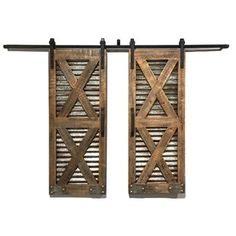 two wooden doors with metal bars on them