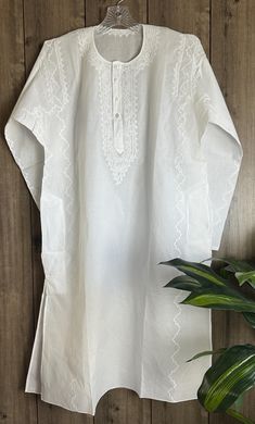 Hand embroidered classic round neck cotton kurta for men. Fine embroidery with "darz" appliqué work. "Size mentioned is the actual garment measurement" Festive Cotton Kaftan With Chikankari Embroidery, Traditional Cotton Kaftan With Embroidered Border, Traditional Fit Kurta With Chikankari Embroidery, Traditional Kurta With Chikankari Embroidery, Embroidered Cotton Kurta For Traditional Ceremonies, Casual White Embroidered Kurta, Cotton Kaftan With Resham Embroidery, Traditional Embroidered White Thobe, Traditional White Embroidered Thobe