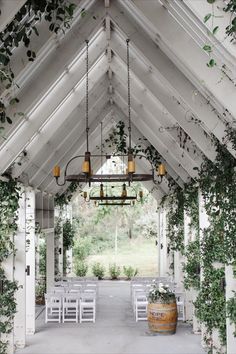 Small wedding venue in a chapel-like open air area with white beams & roof, rustic candle chandeliers and white seating on concrete floor. Wedding Venues Nsw, Australian Wedding Venues, Alternative Wedding Venues, Small Wedding Venue Ideas Indoor, Small Wedding Venues Indoor, Small House Wedding, Small Venue Space, Simple Wedding Venues