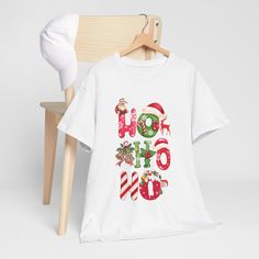 Christmas Hohoho T-shirt Designer Ho Ho Ho T-shirt, sustainable and highly durable, made of 100% cotton mid-fabric (5.3 oz/yd² (180 g/m for all-year comfort. The classic cut of this christmas-themed  T-shirt provides a relaxed and comfortable fit. The tear-off tag means a scratch-free experience without any irritation or discomfort. Made using 100% cotton ethically grown and harvested in the USA. Gildan is also a proud member of the US Cotton Trust Protocol, which guarantees ethical and sustainable production means. This Noel T-shirt is certified by Oeko-Tex for safety and quality assurance. Key features: ✔Shoulder tape-Twill tape covers shoulder seams to secure the back of the garment and prevent stretching ✔Side seams-Knitted in one piece using tubular knit, reducing fabric waste and mak Ho Ho Ho, Christmas Shirt, Twill Tape, Christmas Shirts, Christmas Themes, Santa Claus, Favorite Outfit, Gender Neutral, Christmas Gift