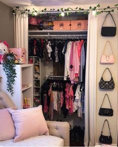 the closet is full of clothes and purses