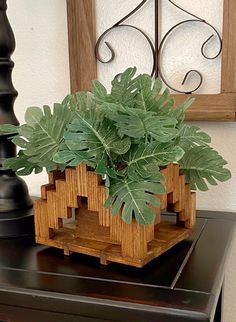 a potted plant sitting on top of a wooden table