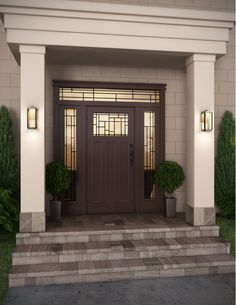 a front door with two potted plants on either side