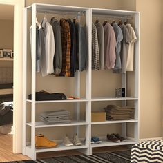 an organized closet with clothes hanging on shelves and shoes sitting on the floor next to it