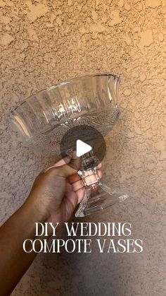 a hand holding a clear glass bowl with the words diy wedding compte vases