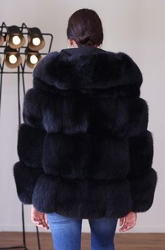 An extravagant statement piece, this oversized faux fur coat with a cozy hood combines warmth and style effortlessly, making a bold fashion statement in chilly weather. Luxuriously soft faux fur drapes elegantly, offering both comfort and a touch of glamour to any winter ensemble. Fluffy Hooded Faux Fur Outerwear, Hooded Fluffy Faux Fur Coat, Hooded Faux Fur Coat With Fluffy Detail, Fluffy Hooded Faux Fur Coat, Black Faux Fur Coat For Cold Weather, Fluffy Hooded Fur Coat For Cold Weather, Hooded Faux Fur Coat With Trim, Black Faux Fur Coat For Winter, Fall Faux Fur Hooded Coat