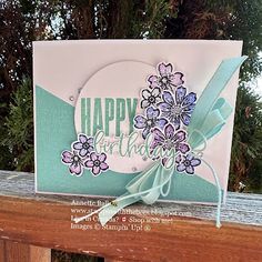 a handmade card with flowers on it and the words happy birthday written in white