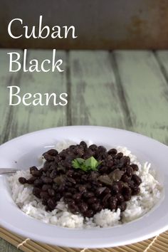 a white plate topped with black beans and rice