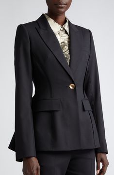 Gorgeous buttons that resemble molten gold add graceful elegance to this virgin-wool-blend blazer tailored in a fitted silhouette with a flared back. 27" front length; 28 1/2" back length (size 2) One-button closure Peaked lapels Four-button cuffs Chest welt pocket; front flap pockets Back vent 92% virgin wool, 6% polyamide, 2% elastane Dry clean Made in the USA Designer Clothing Semi-formal Structured Blazer With Hidden Button Closure, Black Notched Blazer With Hidden Button Closure, Luxury Button-up Blazer With Flap Pockets, Tailored V-neck Blazer With Button Closure, Black Outerwear With Button Closure And Fold-down Collar, Molten Gold, Perfume Gift Sets, Perfume Gift, Fragrance Gift