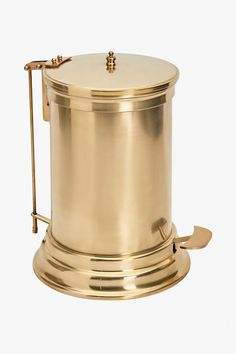 a brass plated coffee pot on a white background