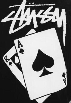 the back of a black shirt with white playing cards on it