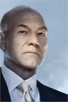 a bald man in a suit and tie looking off to the side with his head tilted back