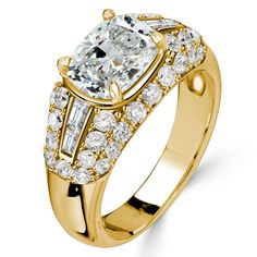 a yellow gold ring with an oval cut diamond surrounded by smaller round diamonds