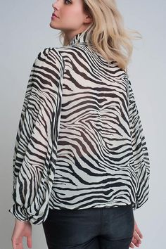 Our oversized voluminous sleeve blouse has an all-over zebra print with button placket and button cuffs. "Voluminous Sleeve Zebra Printed Blouse" 100% Polyester. Black Zebra Print Top For Workwear, White Zebra Print Casual Tops, Casual Stretch Zebra Print Top, Chic Zebra Print Blouse, Plus Size Zebra Top, Olive Top, Flowy Sleeves, Puff Sleeve Blouse, Long Puff Sleeves