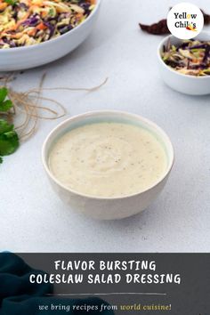 a bowl filled with coleslaw salad dressing next to two bowls full of salad