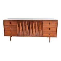 the sideboard is made from wood and has three drawers