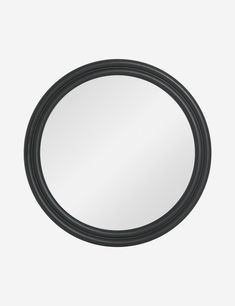 a black round mirror on a white background