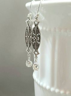 Textured Front, Hollow Back These 1920s inspired earrings feature silver plated Art Deco style brass connectors and sparkling clear Swarovski crystal beads. The dainty brass connectors are very lightweight yet sturdy and slightly hollow on the reverse side. (SEE 2nd PHOTO) They remind me of delicate Edwardian lace. They measure 2 1/2 inches long from the top of the silver plated lever back ear wires to the bottom of the crystal beads An elegant combination for a vintage inspired wedding. ABOUT T Antique Silver Vintage Dangle Jewelry, Vintage Antique Silver Dangle Jewelry, Vintage Antique Silver Dangle Earrings, Vintage Sterling Silver Chandelier Dangle Earrings, Vintage Dangle Earrings For Anniversary, Vintage Sterling Silver Dangle Chandelier Earrings, Vintage Sterling Silver Jewelry For Vintage Events, Sterling Silver Vintage Jewelry For Vintage Events, Sterling Silver Vintage Jewelry For Events