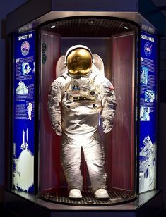 an astronaut's space suit in a display case