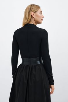 Our Ophelia Belt is a match made for all the garments in your closet. Handcrafted from luxe Italian leather, geometric seam details sculpt the form of the belt and add shape to the waistline. Ophelia's contrast zipper front-and-center makes for eye-catching edge, while an understated elastic panel at the back provides a comfortable stretch fit. Add Ophelia to your dresses, jumpsuits, tunics and beyond...you'll find so many ways to style her. | Maritza Large Belt Outfit, Luxury Corset Belt, Luxury Fitted Corset Belt, Elegant Leather Corset Belt For Fall, Modern Fitted Corset Belt For Party, Chic Fitted Corset Belt For Formal Occasions, Chic Formal Fitted Corset Belt, Luxury Fitted Corset Belt With Belt Loops, Modern Fitted Corset Belt With Belt Loops