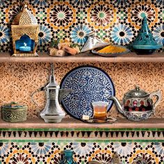 an assortment of decorative items on shelves in a room