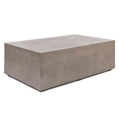 a concrete box sitting on top of a white surface