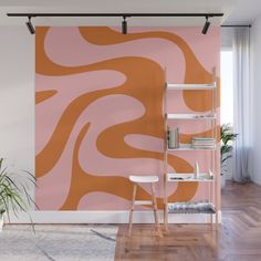 an orange and pink wall mural in a living room