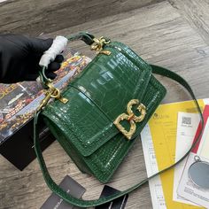 Description D.G Print DG Girls Bag Green For Women 10.6in/27cm DG Rep 1:1 Size: 27 x 8 x 18 cm / 10.6 x 3.2 x 7.1 inches (Length x Width x Height) Adjustable nappa chain strap, inspired by the work of high-quality jewellers Front flap with hand-made jewelled DG in metal alloy with an inlay of pearls Hidden snap button fastening Interior pocket featuring a zip Item comes with branded Dust Bag Includes dust bag. This product is of the best quality. Dolce And Gabbana Print, Louis Vuitton Shirt, Chanel Shirt, Stylish Handbags, Bag Green, Evening Clutch Bag, Girls Bags, Accessories Store, Green Bag