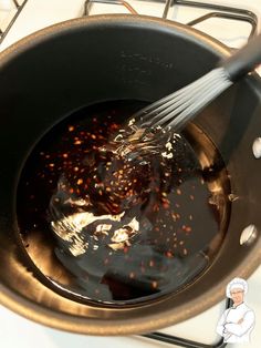 the sauce is being stirred into the pan