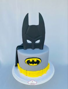 a batman themed cake on a white plate